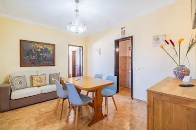 a kitchen with a counter with a microwave and appliances at Villa Pinheiro in Albufeira