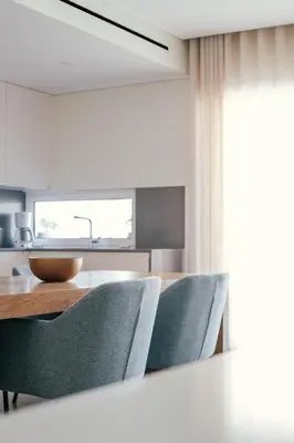 a kitchen with a table with chairs and a sink at Orange Boutique Residence - Casa Diogo in Quarteira