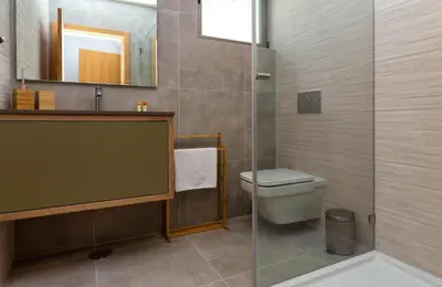 a bathroom with a toilet and a glass shower at Villa Orada 25 by Stay ici Algarve Holiday Rental in Albufeira