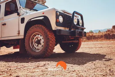 a white truck parked on a dirt road at #132 Velamar 414 by Home Holidays in Albufeira