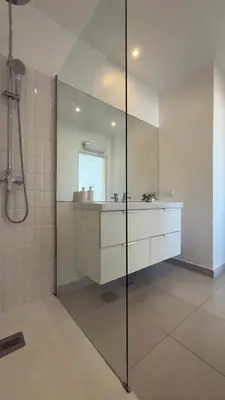 a kitchen with a sink and a microwave at Penthouse S.Jorge Seaview T4 in Quarteira