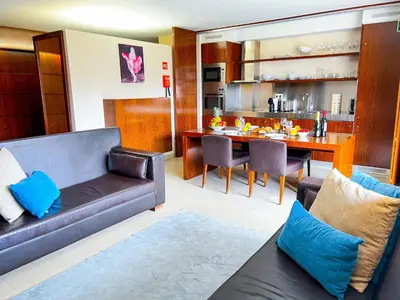 a living room with a couch and a table at Outstanding Condo- Beach, Pool & Golf by BeCherish in Galé