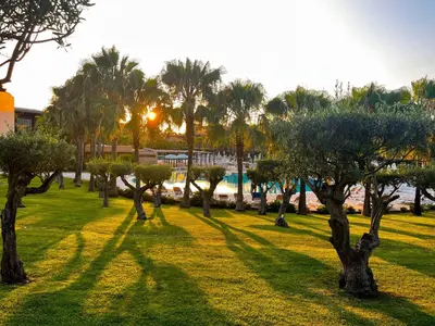 a park with palm trees and a body of water at Outstanding Condo- Beach, Pool & Golf by BeCherish in Galé