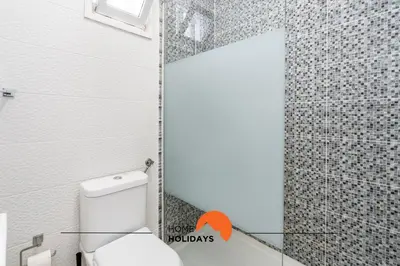 a bedroom with a large bed with yellow pillows at #162 Sumertime Flat by Home Holidays in Albufeira