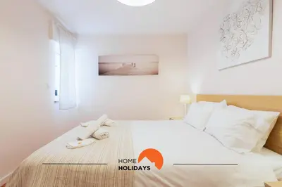 a bedroom with a bed with two towels on it at #165 Liberdade 105 by Home Holidays in Albufeira
