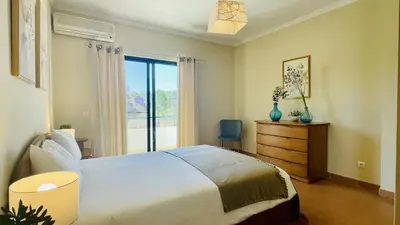 a bedroom with a large bed and a window at Vale Pedras by Check-in Portugal in Albufeira