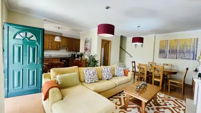 a living room with a couch and a table at Vale Pedras by Check-in Portugal in Albufeira