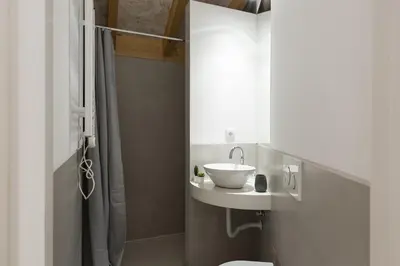 a bathroom with a sink and a shower at Madalena Village 2 - City centre by HD PROPERTIES in Faro