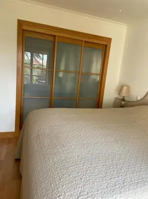 a patio with a couch and a table and chairs at 2 bed Apartment Palmyra Vila Sol in Quarteira