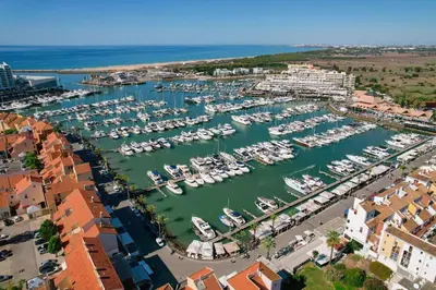 an aerial view of a marina with boats in the water at Centralgarve - Premium Apartment in the Center of Vilamoura - Cota10 in Vilamoura