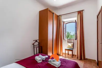 an orange object sitting on top of a hill at #161 T1 Casa dos Avós by Home Holidays in Paderne