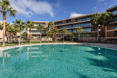 a large swimming pool in front of a building at TAC - Salgados Beach Prime Pool Resort in Guia