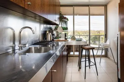 a kitchen with a sink and a counter top at TAC - Salgados Beach Prime Pool Resort in Guia