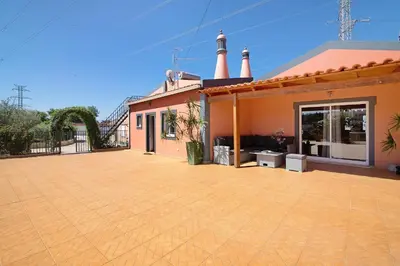 a house with a large patio in front of it at At-tunis in Tunes