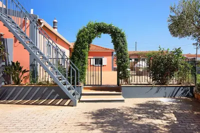 an entrance to a building with a gate and an arch at At-tunis in Tunes
