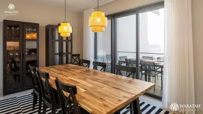 a dining room with a wooden table and chairs at Apartment Micaela in Vale do Lobo