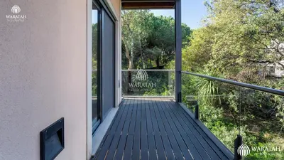 a balcony of a house with glass doors at Apartment Micaela in Vale do Lobo