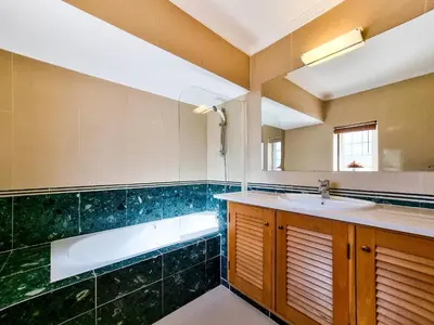 a bathroom with a sink and a bath tub at FLH Quinta das Salinas Triplex with Balcony in Vale do Lobo