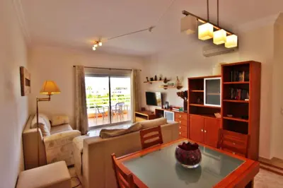 a living room with a couch and a table at ViaMar Apartment in Vilamoura