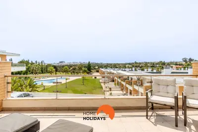 a view of the pool from the balcony of a apartment at #160 V3 Vila Branca 92 by Home Holidays in Albufeira