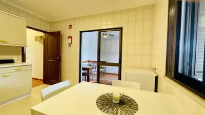 a kitchen with a table with a candle on it at Neridas Villa by Check-in Portugal in Quarteira