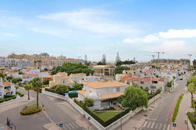 a view of a city with houses and a street at Vilamoura Marina in Vilamoura