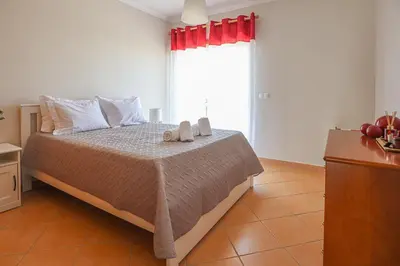 a bedroom with a bed with two towels on it at Apart ALGARVE - Piscina - BY BEDZY in Albufeira