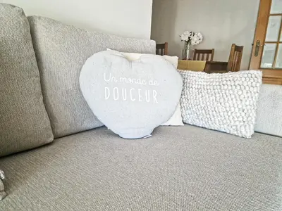 a heart pillow sitting on a couch with two pillows at Apart ALGARVE - Piscina - BY BEDZY in Albufeira