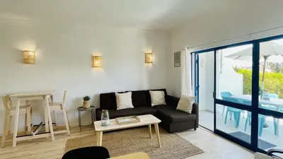 a living room with a couch and a table at Jardim da Oura by Check-in Portugal in Albufeira