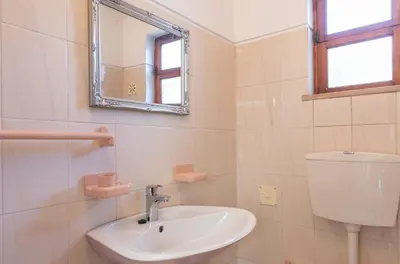 a bathroom with a sink and a mirror at Villa Andrea by Gabi Miguel in Albufeira