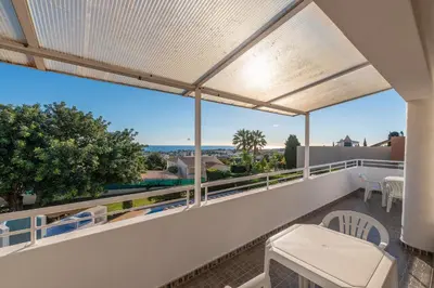 a balcony with a view of the ocean at Villa Andrea by Gabi Miguel in Albufeira