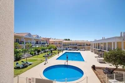 an image of a swimming pool at a resort at T2 Encosta São José by Gabi Miguel in Guia