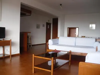a living room with a white couch and a coffee table at Aparthotel Dom Pedro Portobelo in Vilamoura