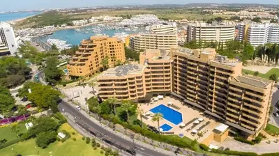 an aerial view of a city with tall buildings at Aparthotel Dom Pedro Portobelo in Vilamoura
