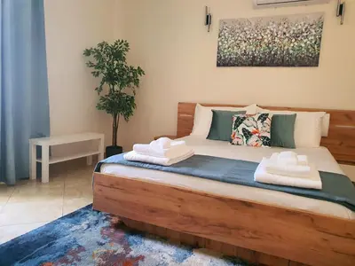 a bedroom with a bed with towels on it at Casa da Vera in Faro