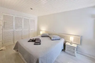 a bedroom with a large bed and a night stand at Paradise full océan in Albufeira