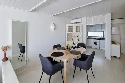 a kitchen and dining room with a table and chairs at Paradise full océan in Albufeira