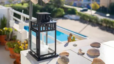 a model of a table with a lantern and shells at Design Top Floor With Balcony & Pool in Vilamoura