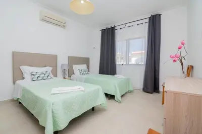 a hotel room with two beds and a window at Avo Isabel by Innkeeper in Guia