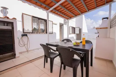 a dining room with a table and chairs at Avo Vitoria by Innkeeper in Guia