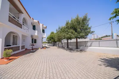 an empty street next to a building at Galé Catia by Innkeeper in Guia