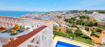 an overhead view of a swimming pool on a house at Corte Real Apartment AE - Sea & Old Town View in Albufeira