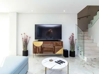 a living room with a tv and a couch at Sea la Vie House by Stay ici Algarve Holiday Rental in Albufeira
