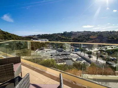 a balcony with a view of a parking lot at Sea la Vie House by Stay ici Algarve Holiday Rental in Albufeira