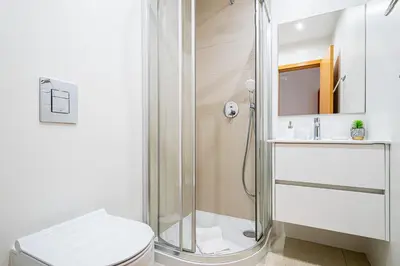a bathroom with a shower and a toilet and a sink at BeGuest Summer Breeze in Vale Parra in Galé
