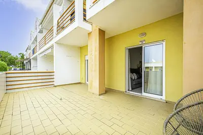 an empty patio of a building with a large window at BeGuest Summer Breeze in Vale Parra in Galé