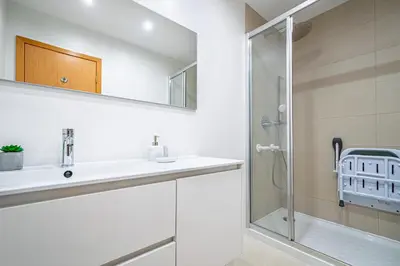 a bathroom with a sink and a shower at BeGuest Summer Breeze in Vale Parra in Galé