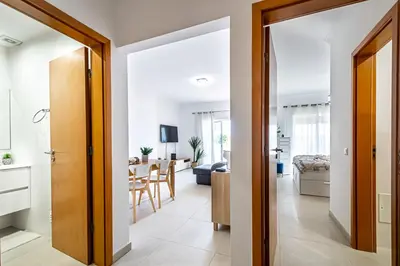 a hallway leading to a living room and a dining room at BeGuest Summer Breeze in Vale Parra in Galé