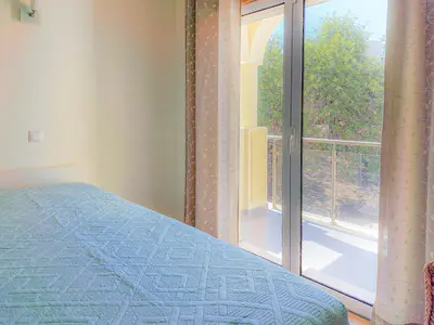 a bedroom with a bed and a large window at Villa ENCOSTA VISTA SALGADOS - BY BEDZY in Guia