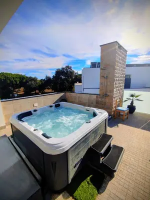 a hot tub sitting on top of a roof at Villa Luz 37 - Jacuzzi Terrace & Swimming Pool in Albufeira